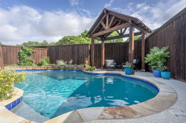 View of pool featuring a fenced backyard and a gazebo | Image 28
