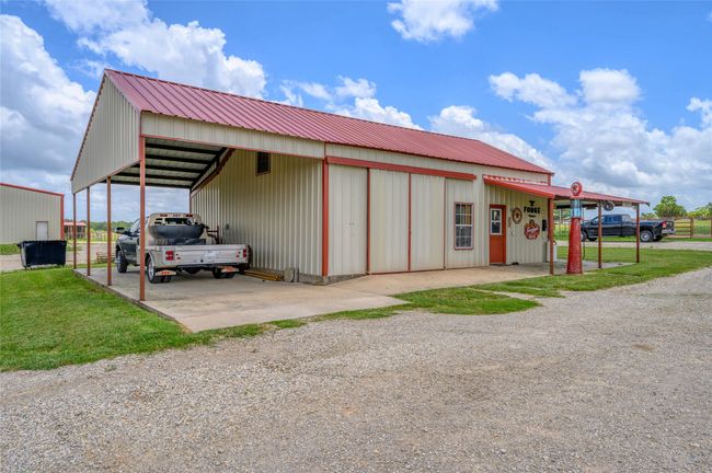 Covered truck parking attached to garage | Image 24