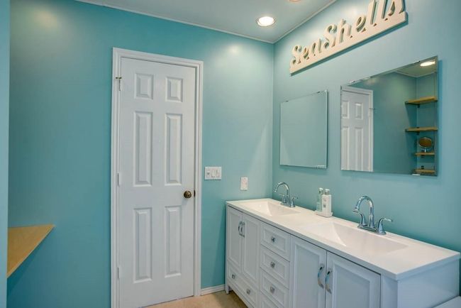 Bathroom with double vanity, recessed lighting, and baseboards | Image 16