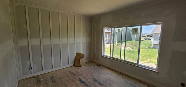 Unfurnished room featuring baseboards | Image 8