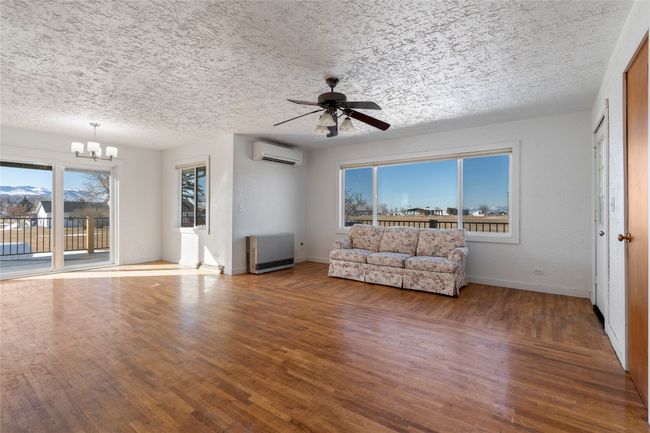 Gorgeous wood-style flooring adds warmth and charm. | Image 29