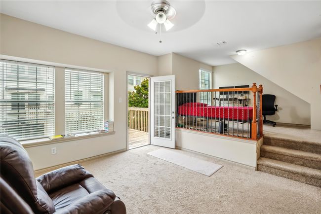 Bedroom featuring carpet flooring, access to outside, and ceiling fan | Image 22