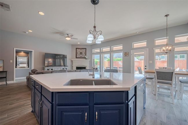 The kitchen opens to the family room, keeping the cook connected and part of the action. | Image 20