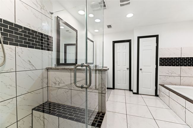 Modern shower, separate commode, his/hers walk-in closets | Image 13