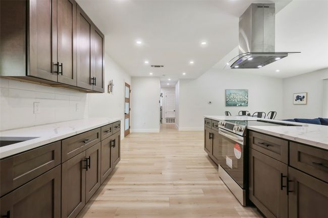 Efficient kitchen is open to living and garage access with | Image 9