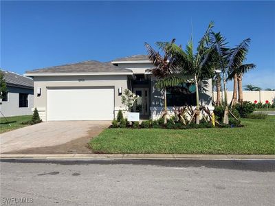 View of front of property with a front lawn and a garage | Image 1