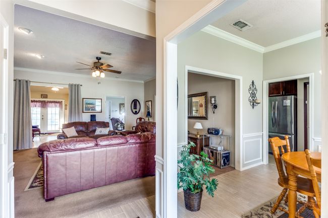 Looking into living room and dining room from front door | Image 5