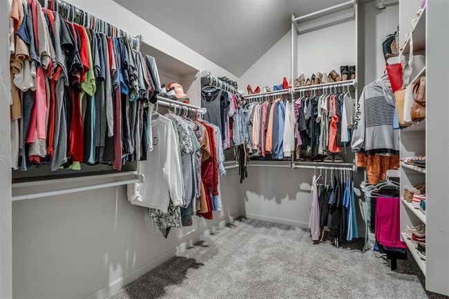 Walk in closet with carpet floors and vaulted ceiling | Image 17