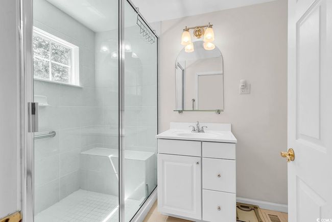 Bathroom with vanity and a stall shower | Image 13