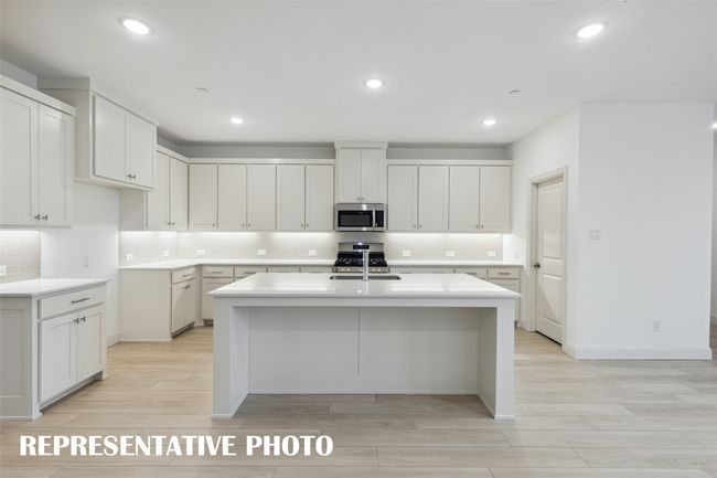The spacious island is the hub of this fantastic home! REPRESENTATIVE PHOTO | Image 8