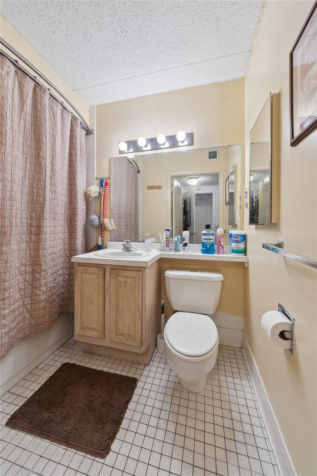 Full bathroom with tile patterned flooring, shower / tub combo with curtain, and vanity | Image 19