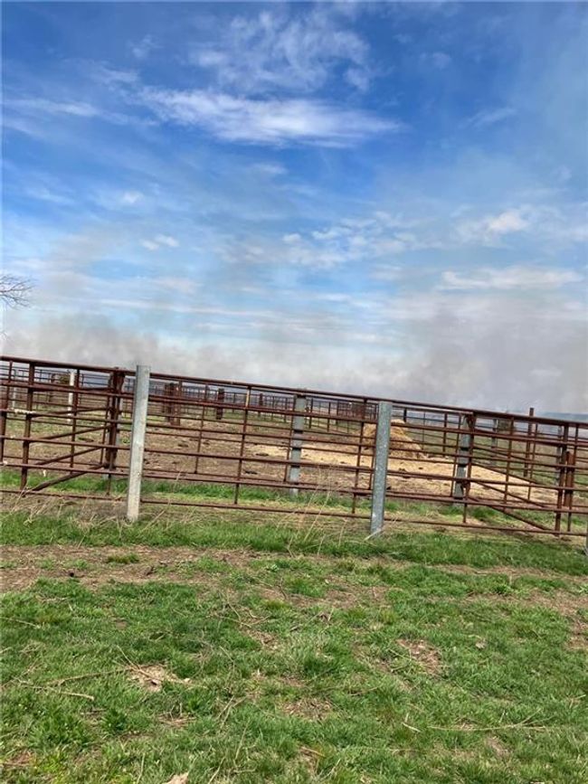 View of yard with fence and a rural view | Image 7