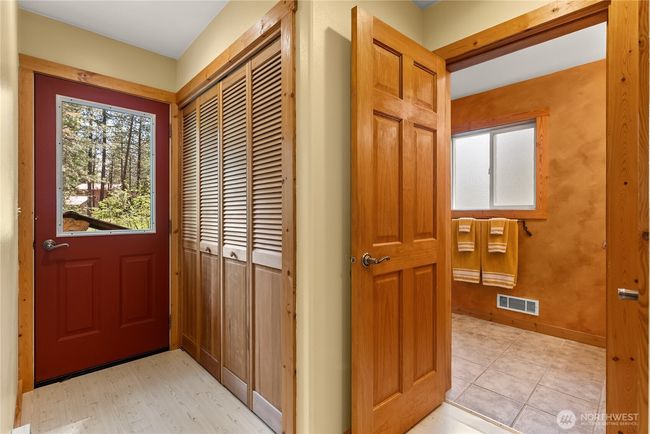 Utility room with washer, dryer, sink, and storage | Image 21