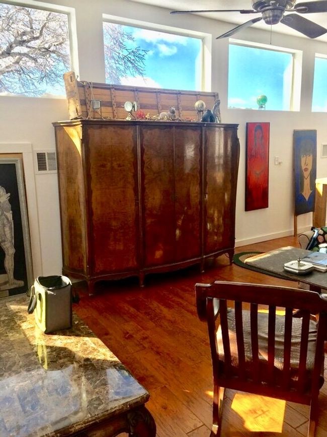 Upstairs bedroom has full bathroom, closet, and large storage and loft with balcony. | Image 22