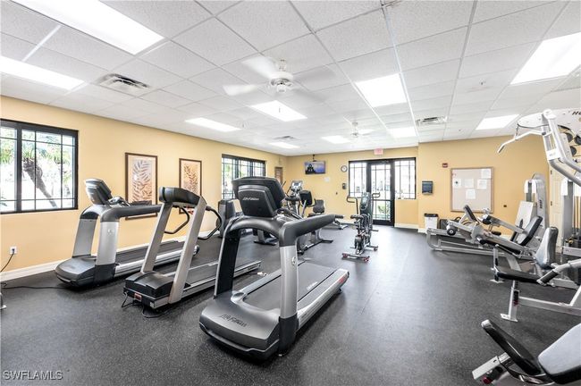 Community gym with a drop ceiling and ceiling fan | Image 23