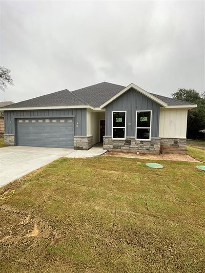 View of front of house with a front yard and a garage | Image 2