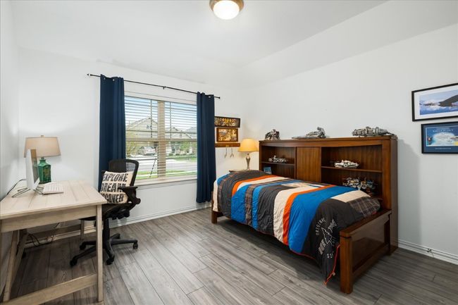 Bedroom featuring baseboards and wood finished floors | Image 26