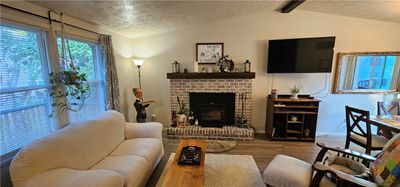 Livingroom-brick fireplace with insert | Image 3