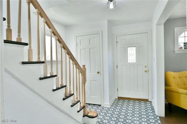 Foyer featuring baseboards, stairway, and tile patterned floors | Image 27