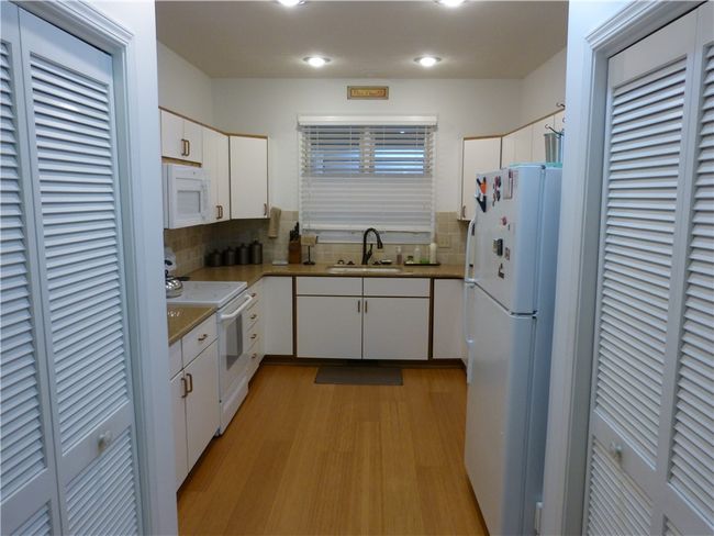 Kitchen with Bamboo flooring | Image 7