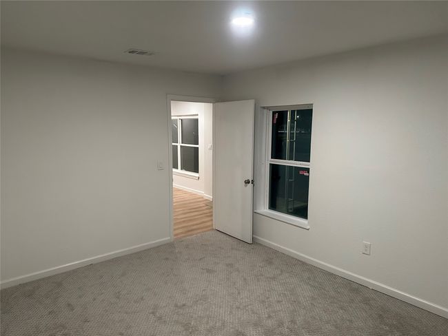 Spare room with baseboards, carpet flooring, and visible vents | Image 27
