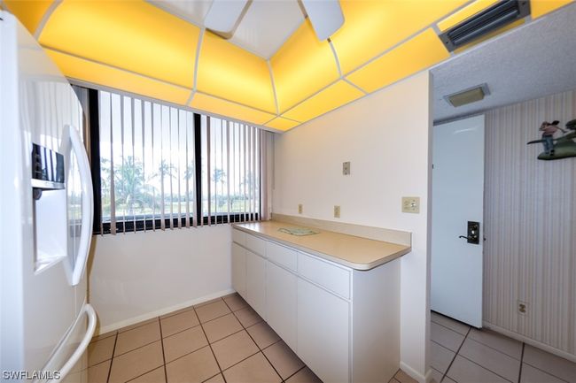 KITCHEN. UNIT ENTRANCE SHOWN AT RIGHT. | Image 7