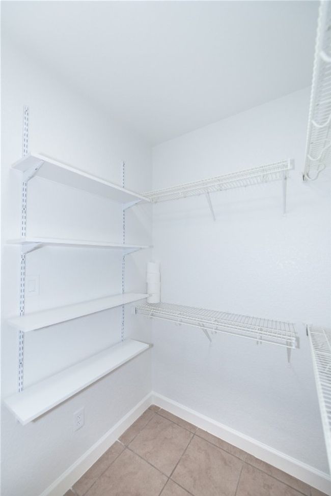 Primary bath, walk in closet area that's to the right of the sink | Image 17