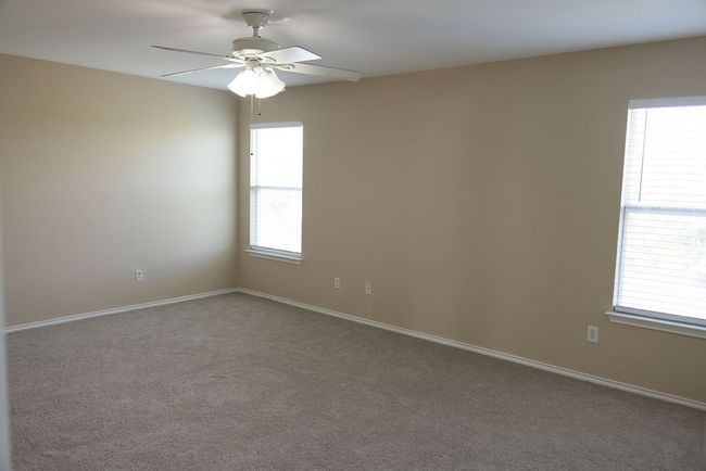 Primary room featuring new carpet flooring, and baseboards | Image 13