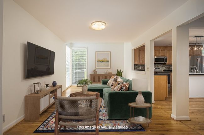 Originally designed as a dining room, this area has been thoughtfully repurposed into a comfortable additional living room—perfect for lounging, reading, or entertaining. It offers versatility to fit your lifestyle. | Image 25