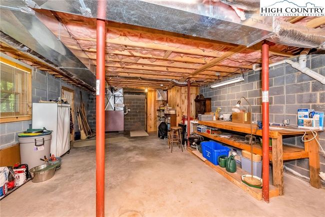 The unfinished basement provides ample room for storage, hobbies, or expansion into additional heated square footage. | Image 24