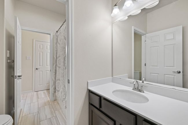 Full bath featuring vanity and a shower with curtain | Image 30