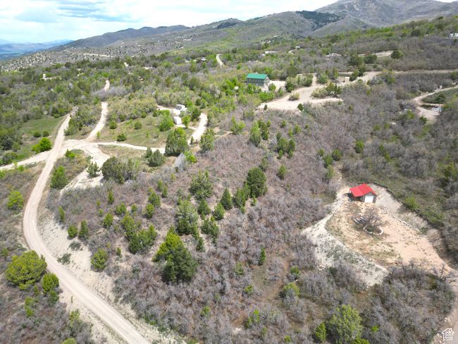 Aerial view of property's location featuring mountains and rural landscape | Image 13