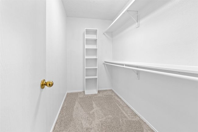 Walk in closet featuring carpet flooring | Image 11