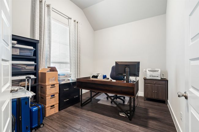 Home office featuring dark wood-style flooring and vaulted ceiling | Image 10