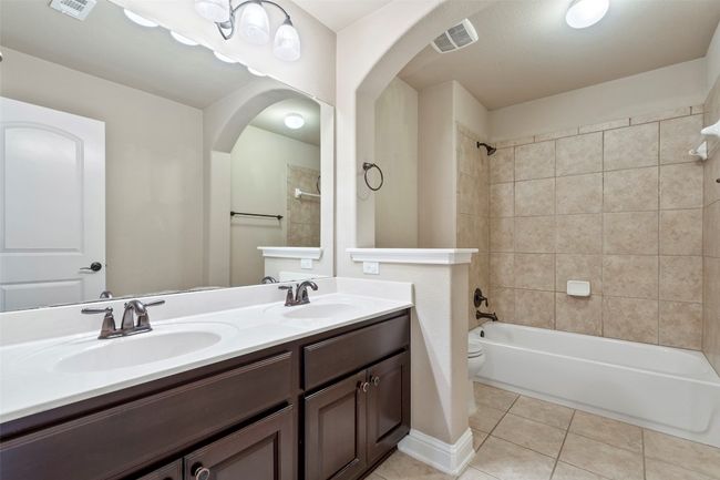 Full bath featuring double vanity, off the game room | Image 27