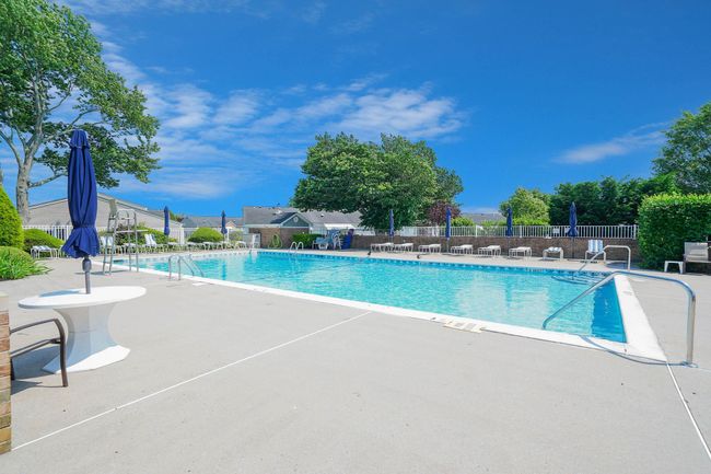 Community pool with a patio | Image 24