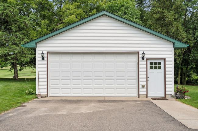 The over sized detached garage is heated and insulated. The roof is only 1 year old. | Image 46