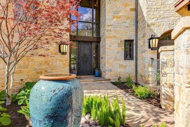 View of exterior entry with stone siding | Image 5