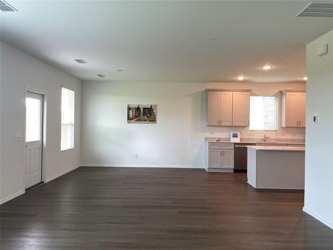 Dining Area featuring light countertops, recessed lighting, dishwasher, dark wood-style floors, and baseboards | Image 12