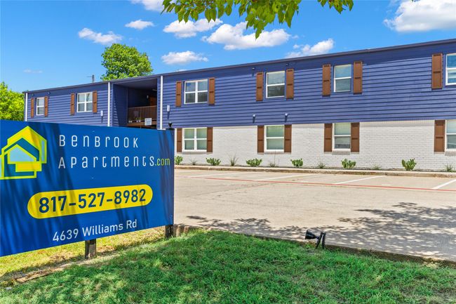 Exterior view of parking and brick siding | Image 5