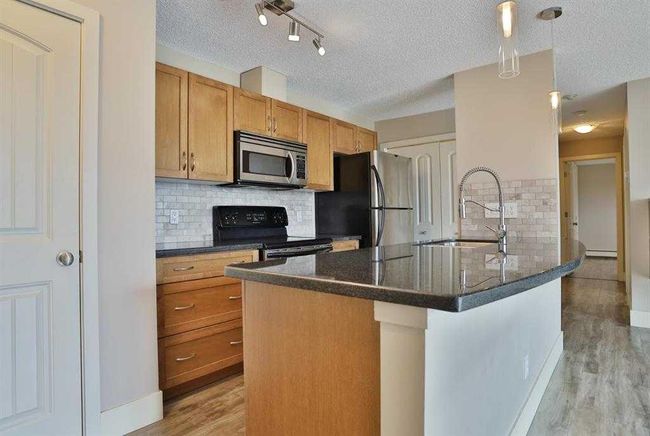 4 - 101 Village Heights Sw, Home with 2 bedrooms, 2 bathrooms and 1 parking in Calgary AB | Image 4