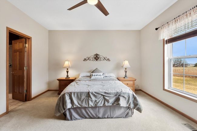 Private ensuite bathroom adds comfort and convenience to this lovely primary suite. | Image 26