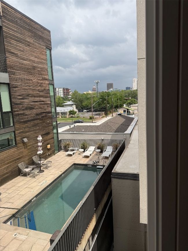 Pool featuring a city view | Image 23