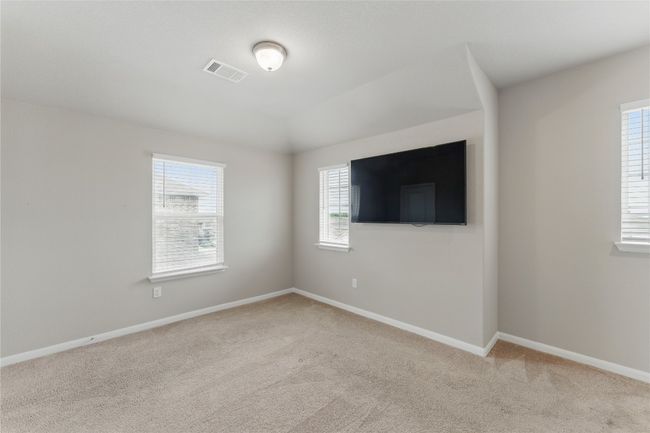 Unfurnished room with visible vents, baseboards, and light colored carpet | Image 29