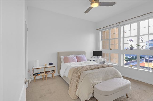 Carpeted bedroom with ceiling fan and baseboards | Image 14