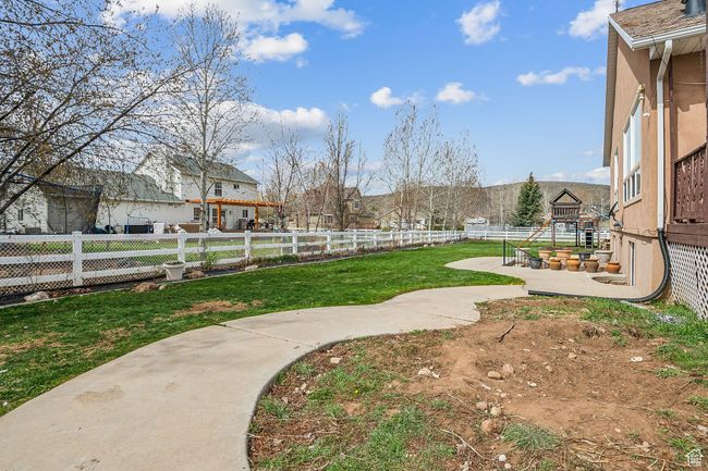 View of yard featuring fence | Image 56
