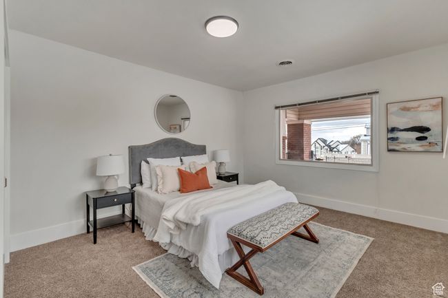Bedroom featuring visible vents, baseboards, and carpet | Image 6