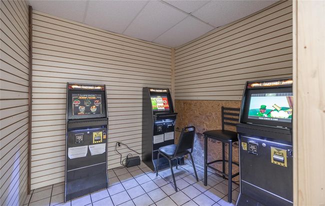 featuring a paneled ceiling and tile patterned floors | Image 9