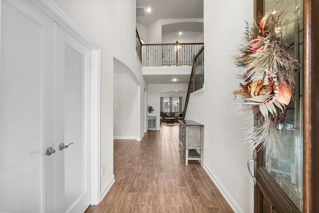 High ceilings, wood-look tile throughout common areas and plentiful natural light! | Image 5