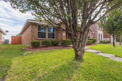 View of front of home with a front yard and cooling unit | Image 2